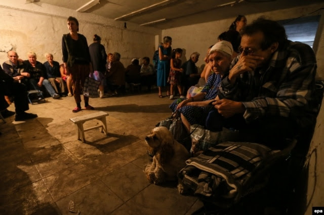 Residents hide in a shelter in Makeyevka near Donetsk in mid-August.
