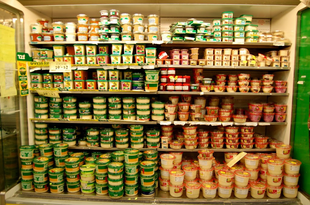 Wall of hummus in Israeli grocery store