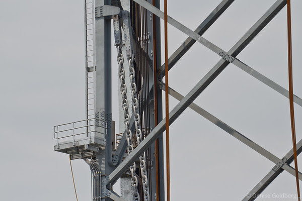 center span raised, counterweight chains bearing weight on the side of the tower