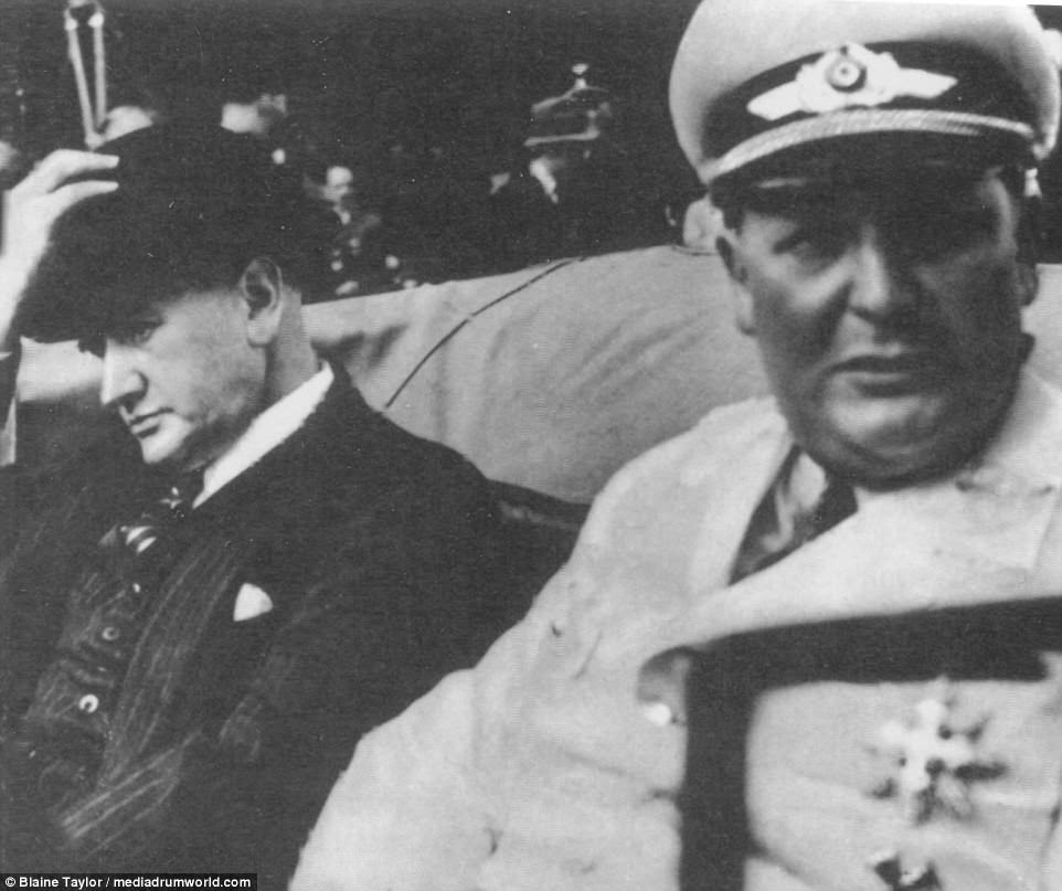 Two political opposites ignore each other: French Premier Édouard Daladier and a bloated Goering, now decked out in Luftwaffe summer whites. Trying to cheer up the glum French pol, Our Hermann simply jumped into the latter's assigned car, uninvited. The ploy failed, 30 September 1938