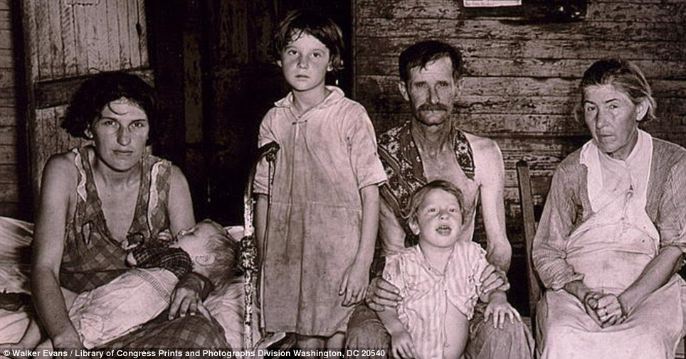 Barely surviving: Bud Fields and his family at his home in Alabama in 1935 