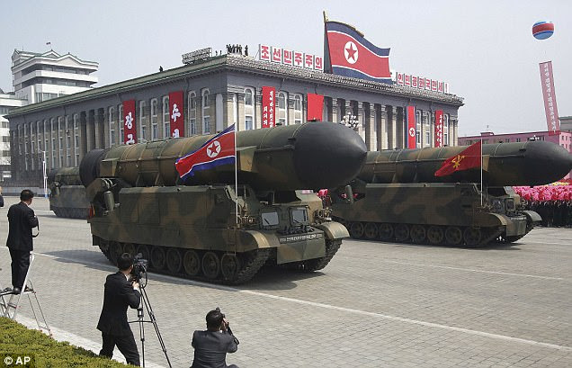 Missiles are paraded across Kim Il Sung Square during a military parade on Saturday
