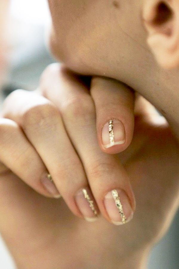 Le Fashion Blog Gold Glitter Striped Nails Nail Art Holiday New Years Inspiration Backstage Delpozo FW 2015