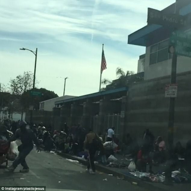 This is what Christmas Day looked like this year for thousands of homeless people in dark and dingy Skid Row - the underbelly of Downtown Los Angeles