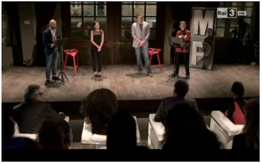 Last challenge in front of the jury and a crowd of invited onlookers; the contenders are supported by major writers, on the right, Savic by Susanna Tamaro and Raffaella Silvestri by Donato Carrisi.