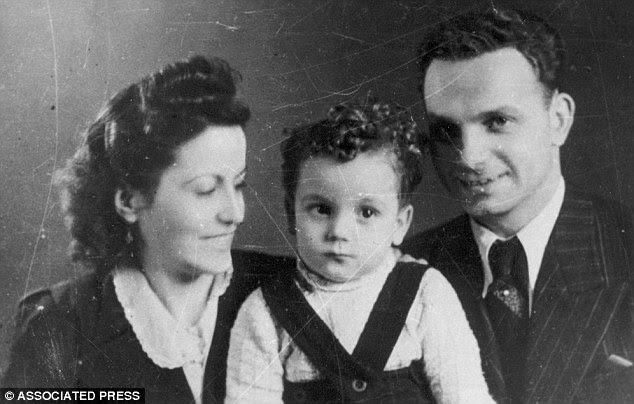 Unsettling portrait: Brasse took this photo of SS officer Fremel Rudolf with his wife and son in exchange for extra food
