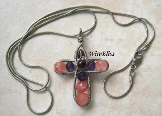 wire cross with Cherry Quartz, amethyst and garnets