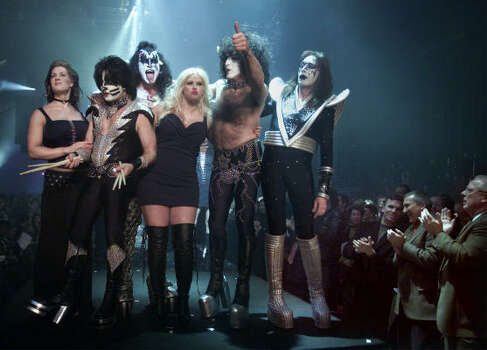 Smith is surrounded by members of KISS at the conclusion of the Spring/Summer Lane Bryant Lingerie Fashion Show in New York City in 2002. Photo: ROBERT MECEA, Associated Press