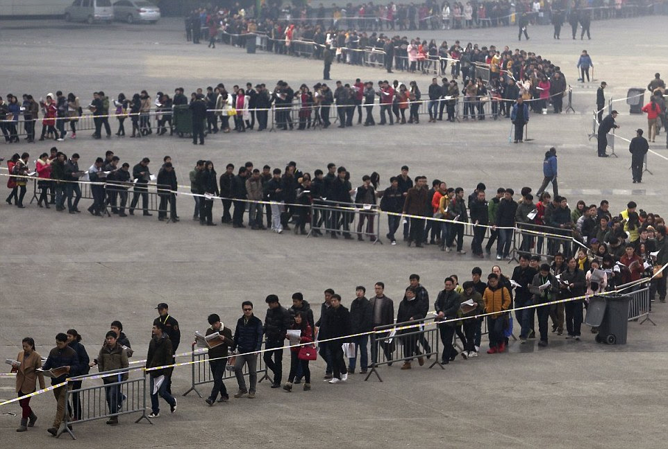 College students queue up for a job fair in 2014, which roughly 50,000 people attended in Zhengzhou, Henan province