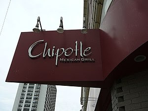 A Chipotle restaurant sign