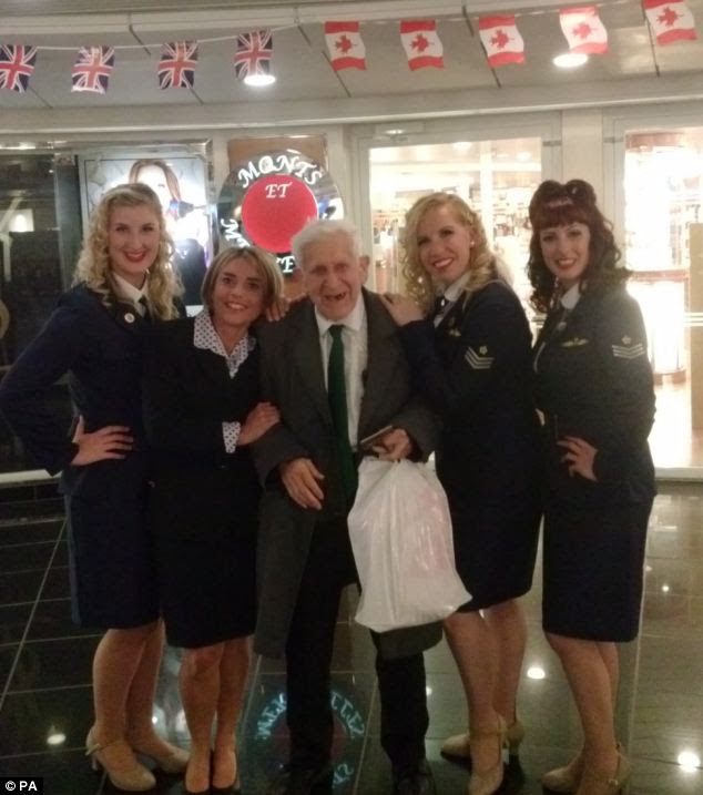Journey: Mr Jordan (centre) pictured onboard a ferry to France with a cabin crew and members of the Candy Girls entertainment troupe. Staff described him as a 'charmer' and said he had been a hit with the ladies