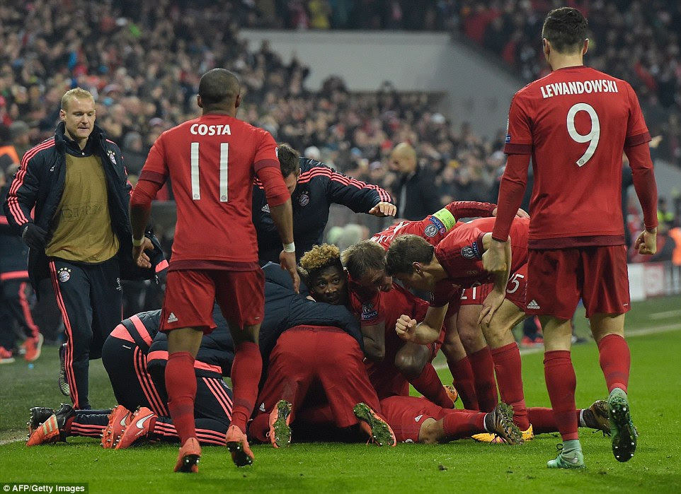 The Bayern Munich squad pile on goalscorer Alcantara as they held the lead for the first time on Wednesday evening in Germany