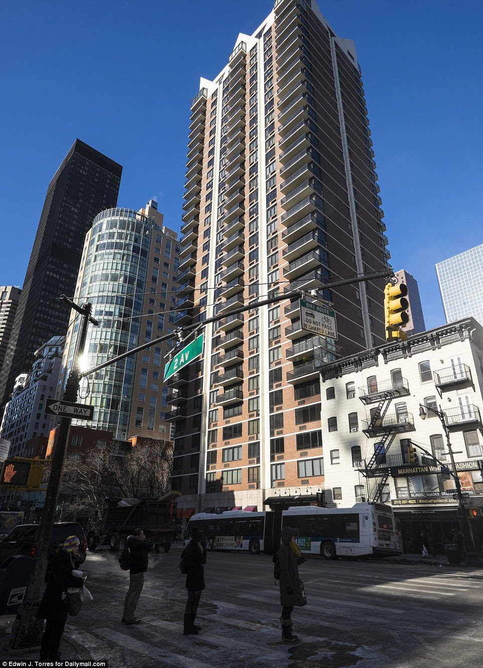 The intersection of Second Avenue and East 50th Street (which shows the same scene as above, right). The Chrysler building is now obscured by apartment blocks