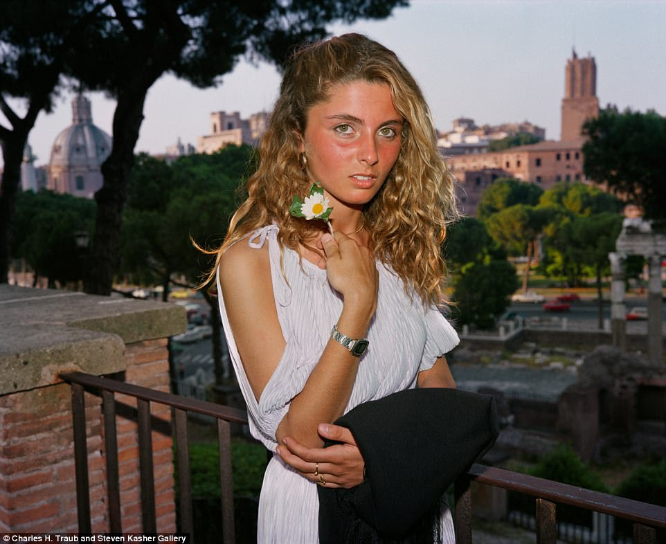 A young, sunkissed woman poses for Traub on a balcony overlooking Rome in 1981