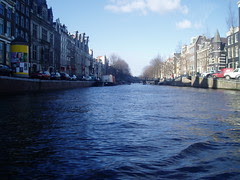 Canal in Amsterdam looked in a boat