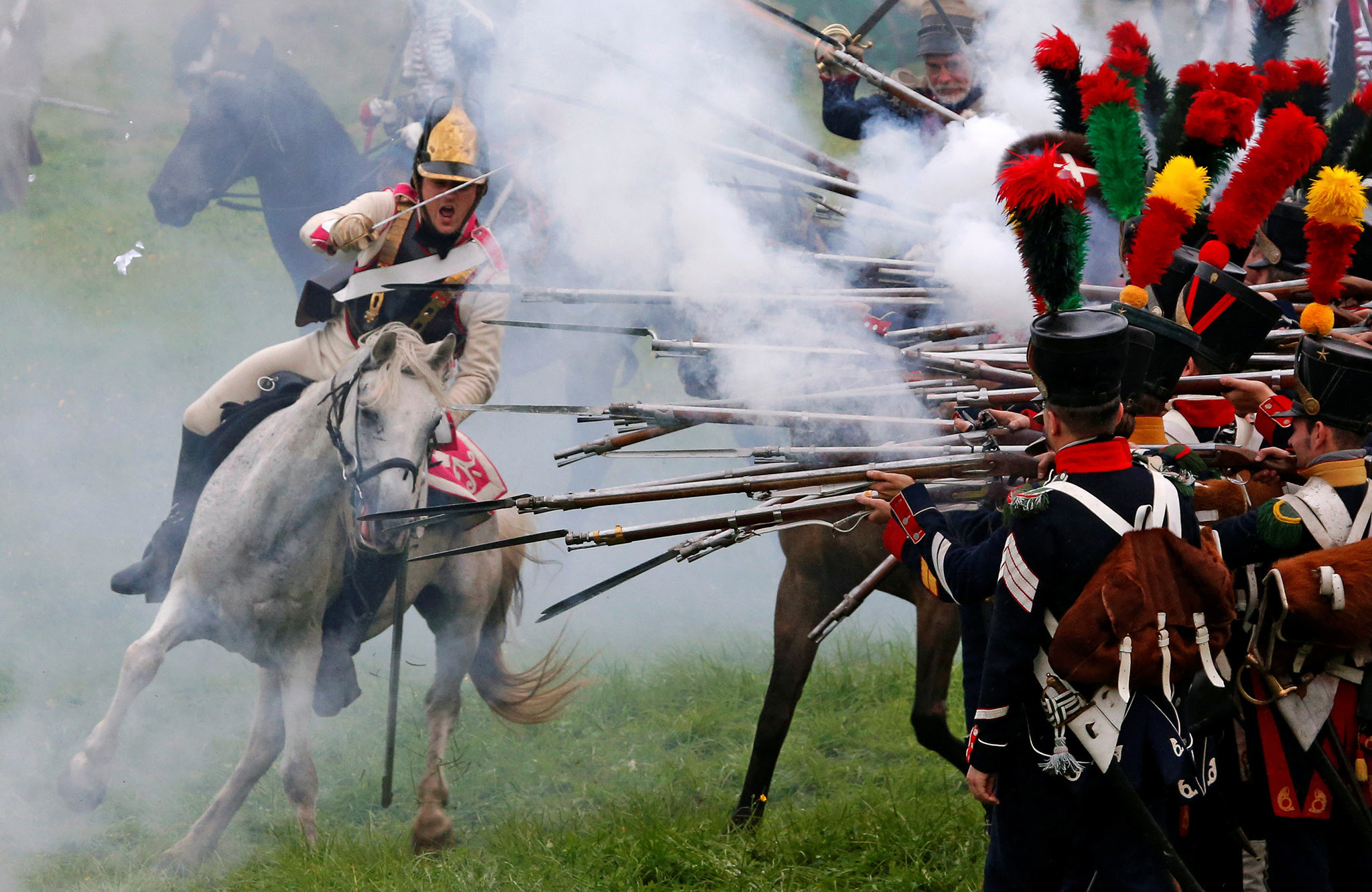 Participants reenact the 1812 Battle of Borodino between Russia and the invading French army during anniversary celebrations near Moscow, Russia