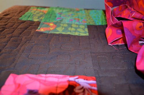 A look at the quilting pattern and the binding fabric.