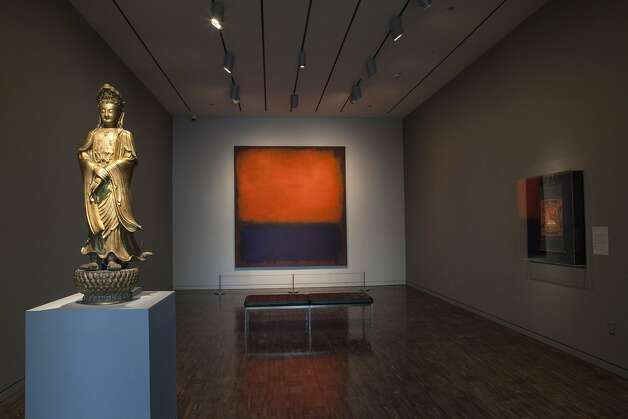 An installation view of "Gorgeous," mixing Asian Art Museum and San Francisco Museum of Modern Art pieces, features Bodhisattva Avalokiteshvara (Quanyin) (1600-1700), gilt bronze (left), and Mark Rothko's "No. 14, 1960," oil on canvas. Photo: Kaz Tsuruta, Asian Art Museum, S.f.