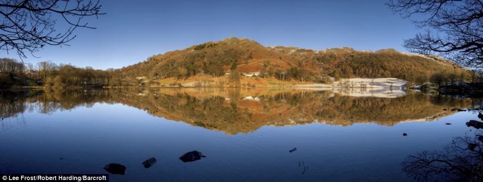 Picturesque: A typically British autumnal scene across Loughrigg Tarn near Ambleside in the Lake District