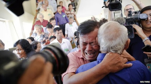 Soum Rithy, who lost his father and three siblings, reacts to the verdict in Phnom Penh on 7 August 2014