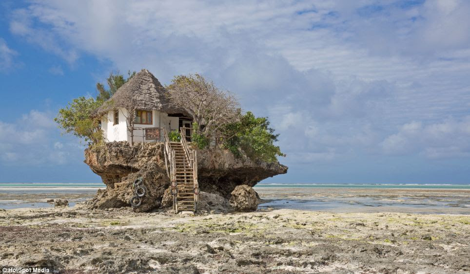 At low-tide, the Rock Restaurant, in Zanzibar, East Africa, can be reached on foot. At other times of the day, diners are transported to and from the rock by boat