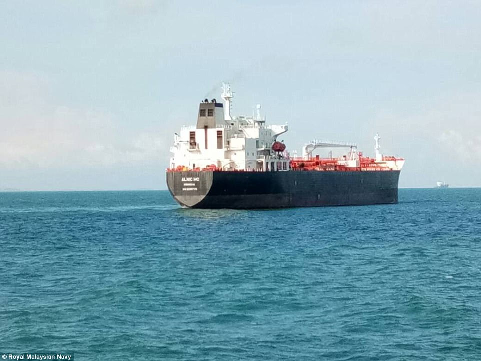 The John McCain was involved in a collision with the merchant vessel Alnic MC (pictured Monday). The Singapore government said no crew were injured on the Liberian-flagged Alnic, which sustained damage to a compartment at the front of the ship some 23 feet above its waterline
