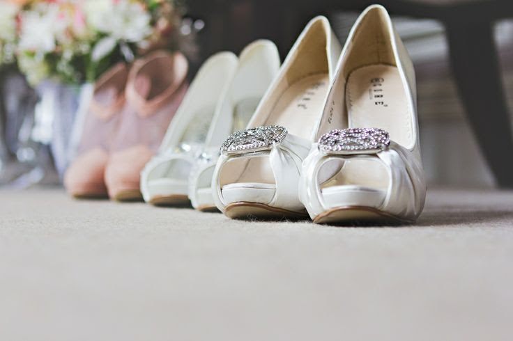 A detail photograph of the bride's and bridesmaids wedding shoes