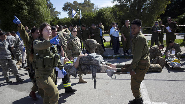 American servicemen and Israeli soldiers participate in a joint drill simulating a rocket attack at a base in Hatzor (Photo: AP, file photo) American servicemen and Israeli soldiers participate in a joint drill simulating a rocket attack at a base in Hatzor (Photo: AP, file photo)