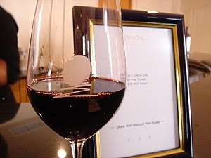 A glass of the California Meritage wine Opus O...
