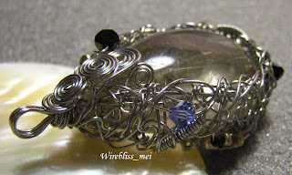 Wire wrapped pendant Wire wrapped entangled rutilated quartz pendant