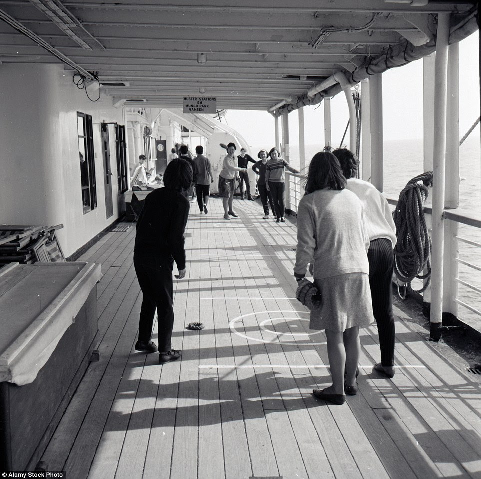 Passengers make use of the deck space to play games as they sail to their destinations on the British India cruise liner, circa 1950s
