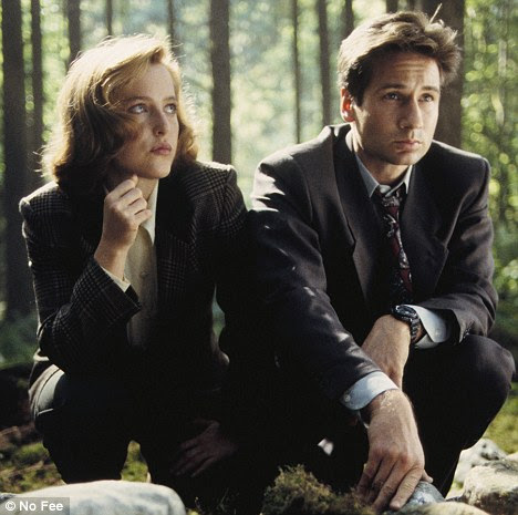 It's a mystery: Mulder and Scully, played by David Duchovny and Gillian Anderson, in hit U.S. sci fi series The X Files