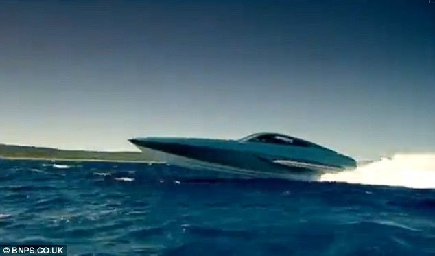 The carbon fibre and kevlar craft streaks across the sea powered by two huge engines 