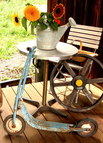 new blue scooter at home on the barn porch