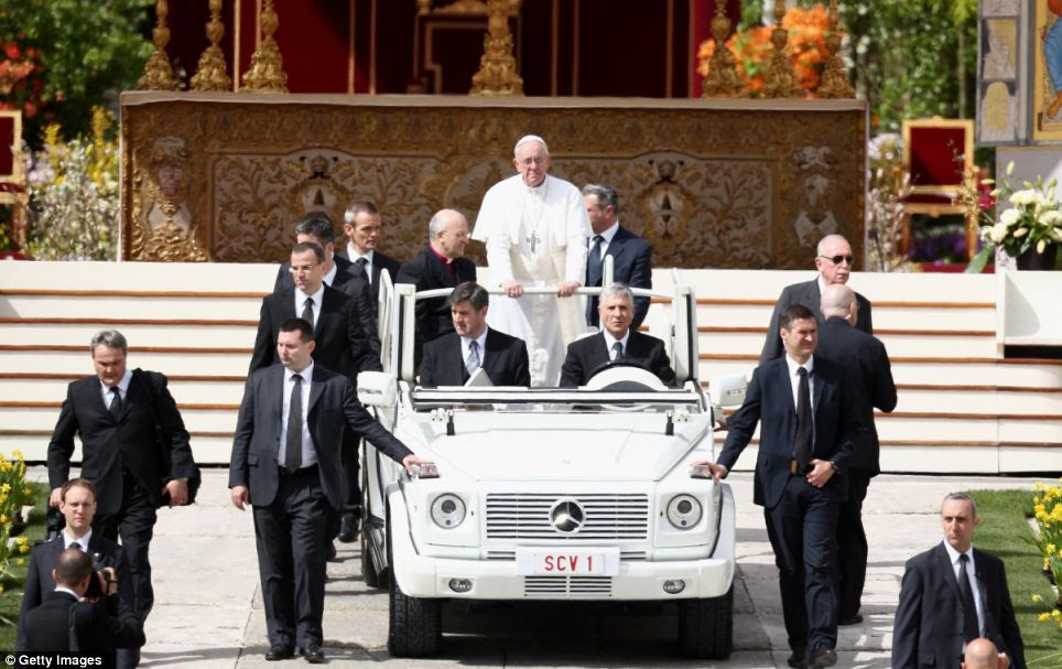 Popemobile: Pope Francis greets the faithful prior to his first 'Urbi et Orbi' blessing