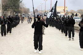 Fighters of al-Qaeda linked Islamic State of Iraq and the Levant parade at Syrian town of Tel Abyad