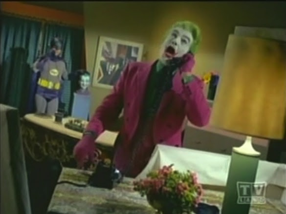 Hey, look, Joker's got a bust of himself that you can tilt back and expose the secret button to the Joker cave! Harley Quinn