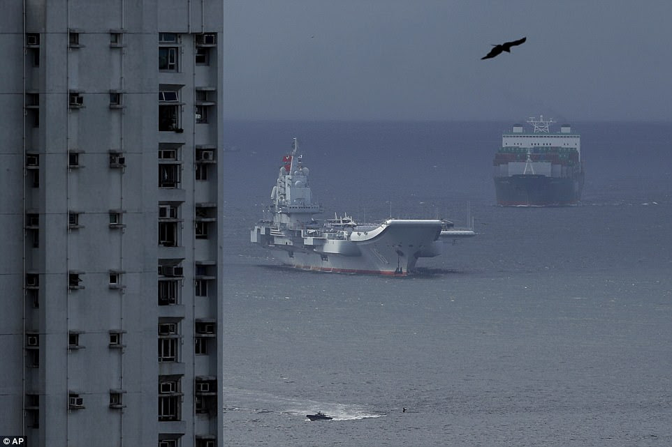 The aircraft carrier sailed through the East Lamma Channel, passing by residential buildings located on the south coast of Hong Kong island, and was berthed near the Tsing Yi region