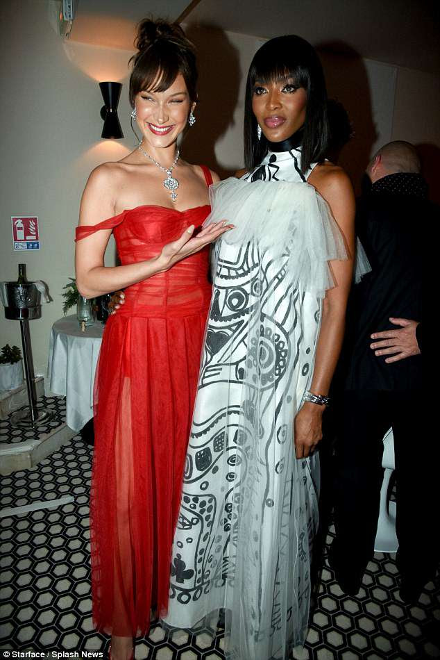 Prodigy: Bella couldn't help but smile as she posed alongside Naomi and raised her hand in admiration of the legendary supermodel