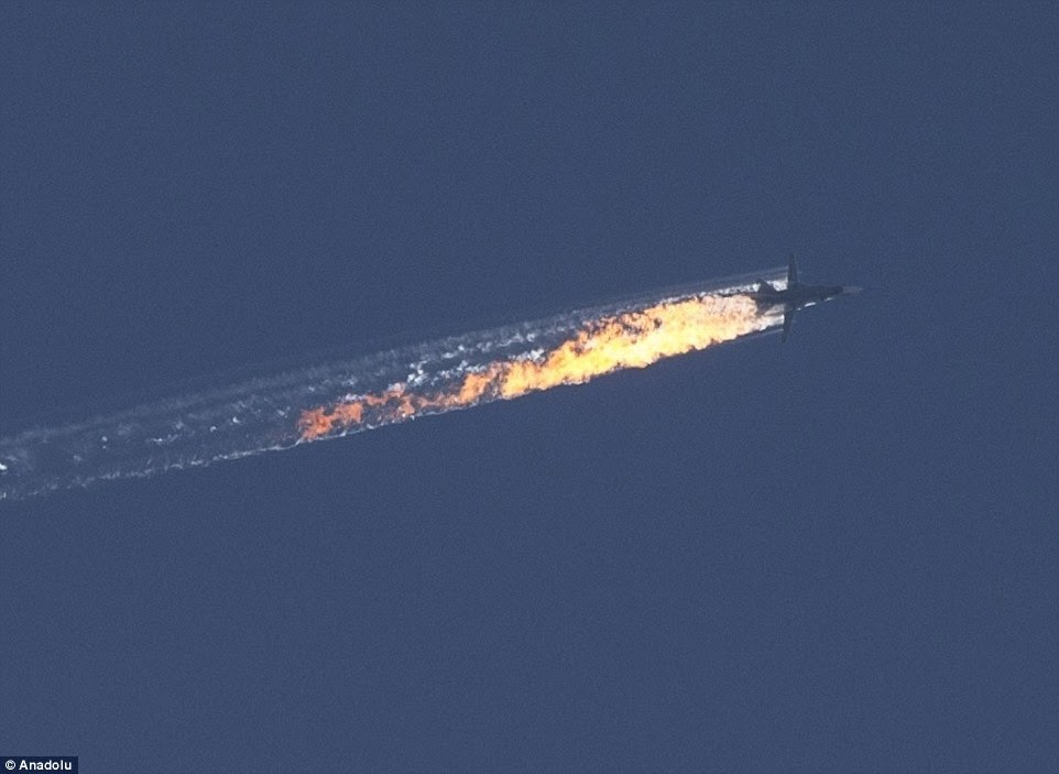 This image shows the moment the Russian Sukhoi Su-24 jet was shot down by Turkish F-16 fighter planes near the Turkish-Syrian border, in Hatay, which has seen NATO call an 'extraordinary' meeting and Russian President Putin warn of 'serious consequences' 