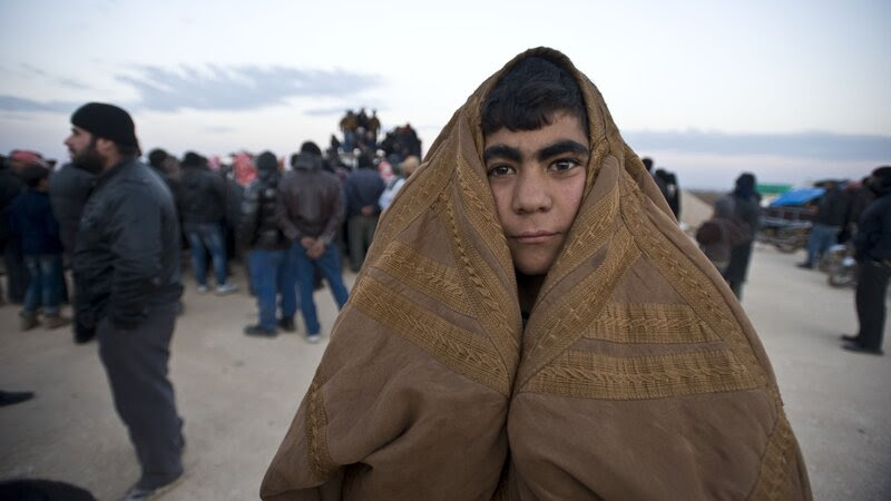 A Syrian man is among the thousands who have fled the fighting in and around the northern city of Aleppo. Thousands of Syrians have gathered at the Bab al-Salam crossing in an attempt to enter Turkey, which has kept the gate closed. Syrian government troops, assisted by Russian airstrikes, have been making gains in the Aleppo area. A Syrian man is among the thousands who have fled the fighting in and around the northern city of Aleppo. Thousands of Syrians have gathered at the Bab al-Salam crossing in an attempt to enter Turkey, which has kept the gate closed. Syrian government troops, assisted by Russian airstrikes, have been making gains in the Aleppo area.