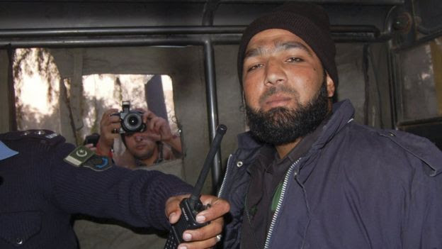 Malik Mumtaz Hussain Qadri, a bodyguard who killed Punjab governor Salman Taseer, is photographed after being detained at the site of Taseer's shooting in Islamabad, in this 4 January 2011 file picture