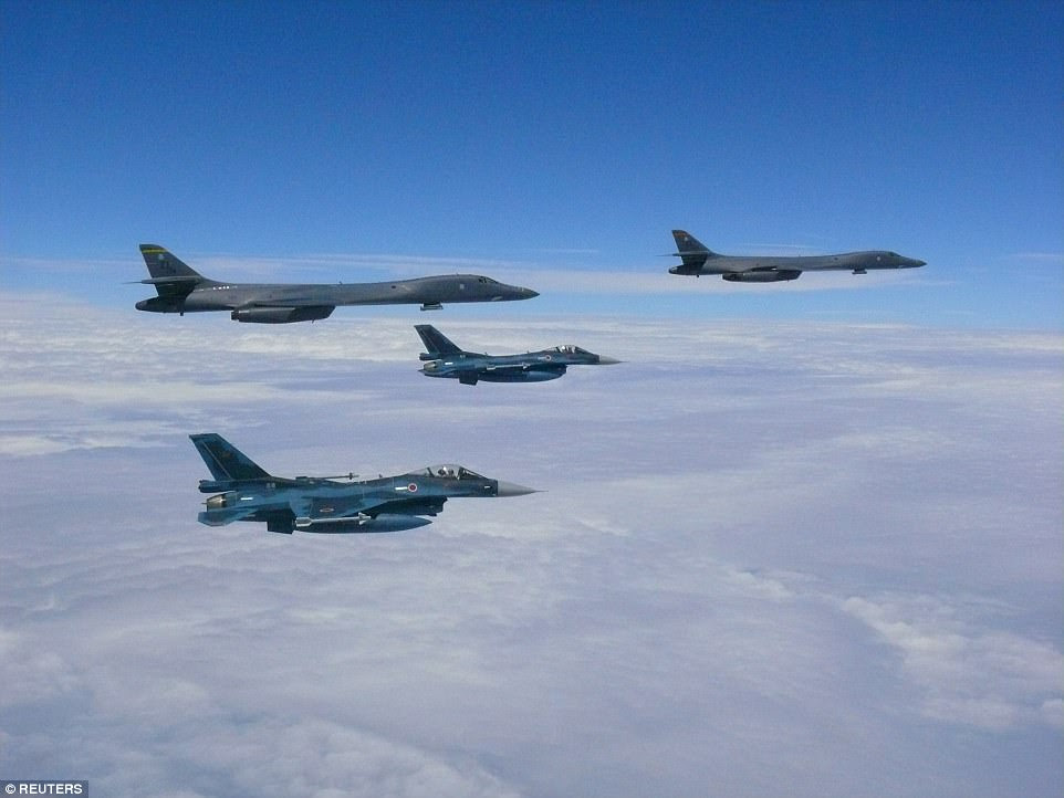 Two U.S. Air Force B-1B bombers from Guam's military base  participated in a strategic bilaterial mission with South Korea and Japan hours before North Korea threatened to strike Guam. Pictured top left and right are the two B-1B Lancer bombers and bottom left and center are Japan Self-Defense Forces F-2 fighter jets near Kyushu, Japan during the mission
