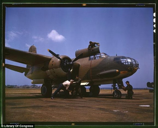 Maintenance men: Servicing an A-20 bomber at Langley Field in Virginia (Alfred Palmer, July 1942)