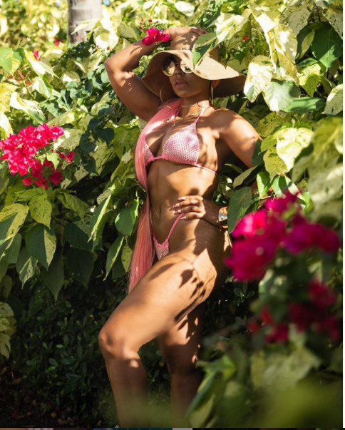 Bikini-clad Ashanti flaunts her hot body in new photos as she continues to celebrate her 40th birthday in Antigua