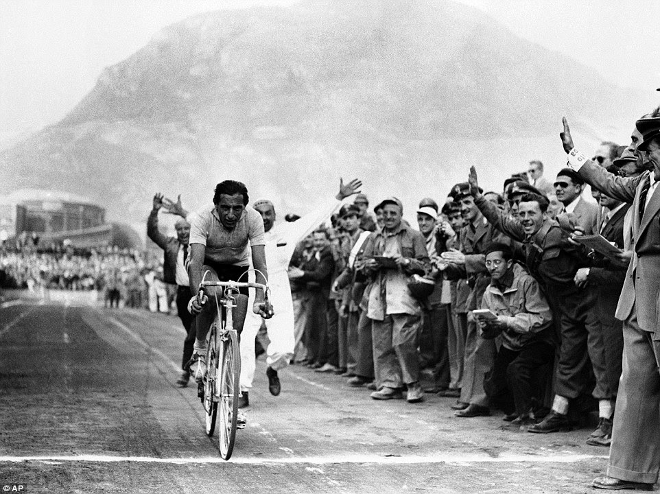 Glittering events: Italy's Fausto Coppi finishing the seventeenth lap of the bicycle race across Italy, on June 5, 1952.