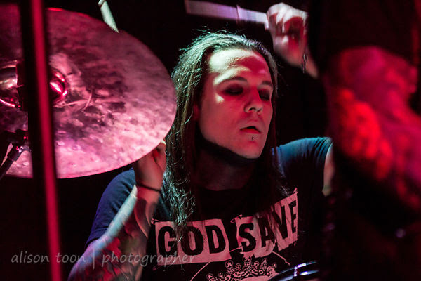 Trixx, on drums with Escape The Fate