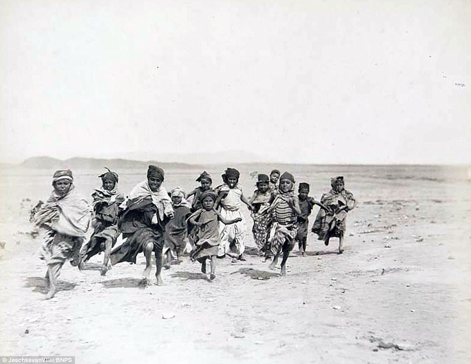 This image of children sprinting through the Sahara Desert in the late 19th century forms part of the book going on sale