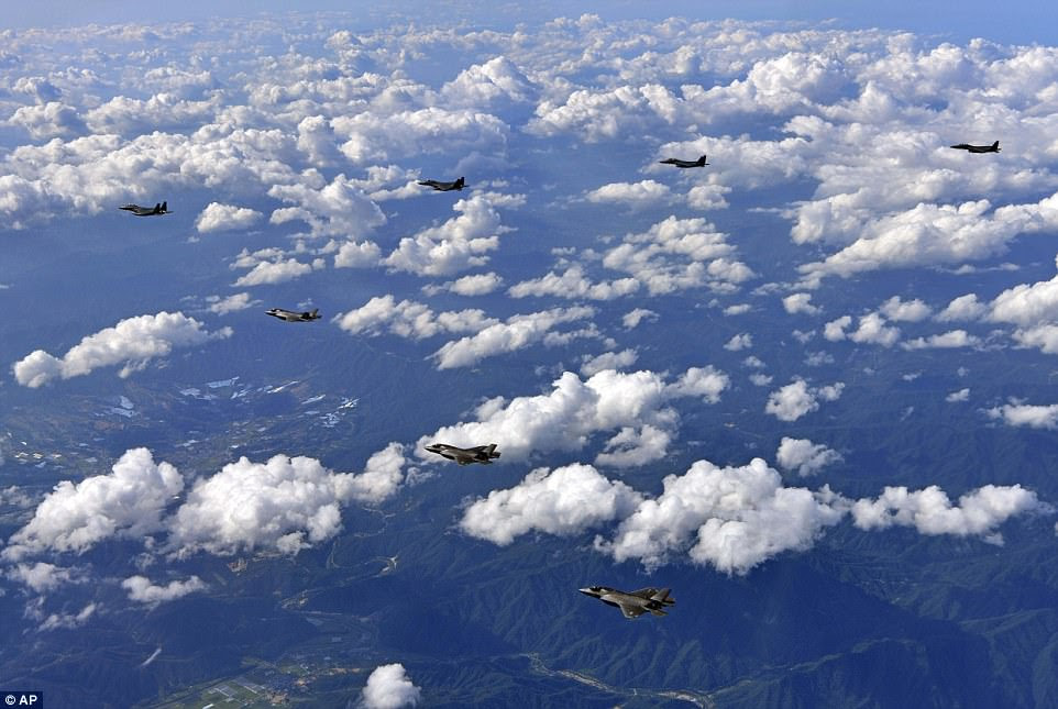 In this photo provided by South Korea Defense Ministry, U.S. Air Force F-35 stealth fighter jets and South Korean F-15 fighter jets fly over the Korean Peninsula on Thursday 