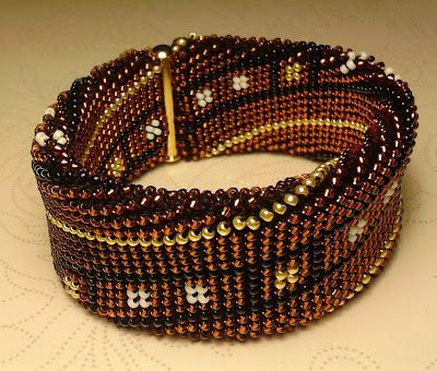 http://www.pinterest.com/pin/359513982724900349/ Crocheted cuff bracelet by P@tty Perline - flat-tubular crochet, with pattern on the website